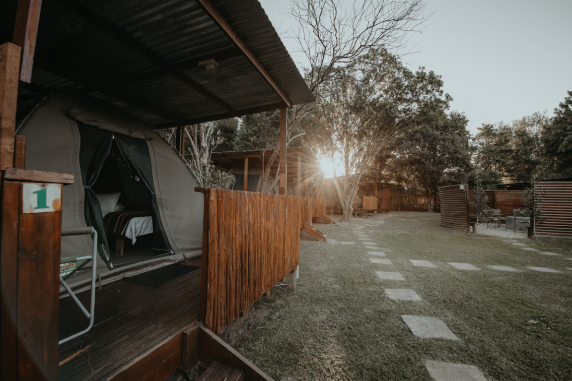Safari tents nestled under indigenous trees at Storms River
